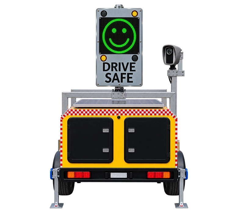 Mobile Traffic Radar Speed Camera Sign Yellow mobile trailer with a radar speed sign displaying a green smiling face, amber warning lights, “Drive Safe” message and mounted camera.
